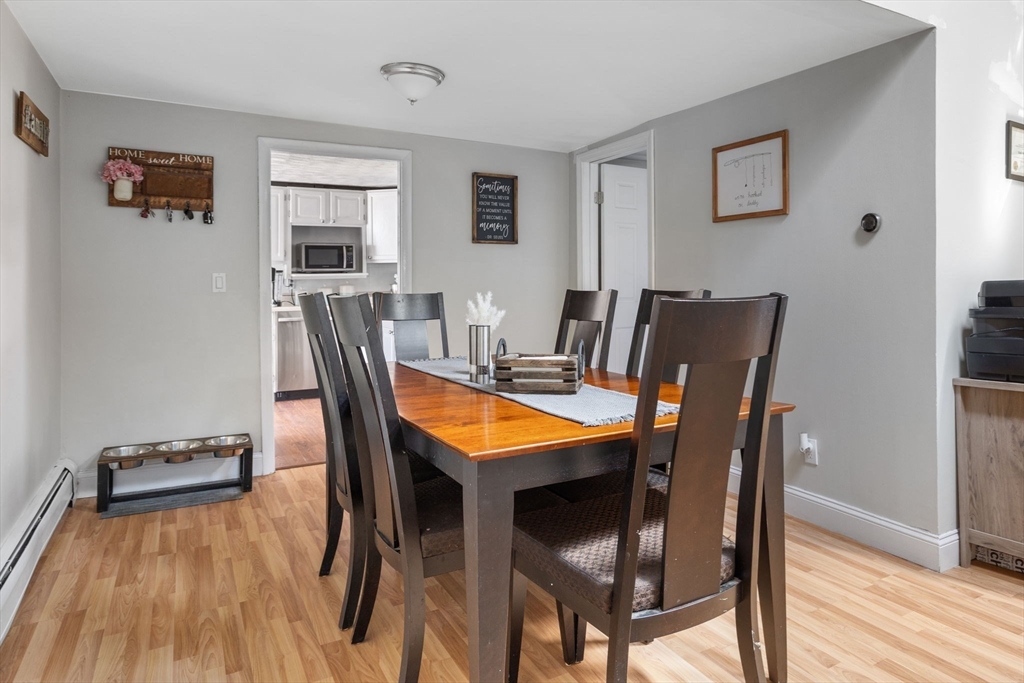 11 Mayflower Road Norton, MA 02766 - Photo 8 of 22 a dining room with furniture and wooden floor
