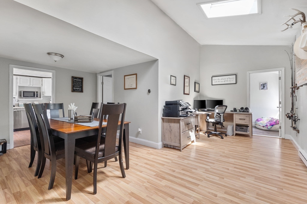 11 Mayflower Road Norton, MA 02766 - Photo 9 of 22 a view of a dining room with furniture and wooden floor
