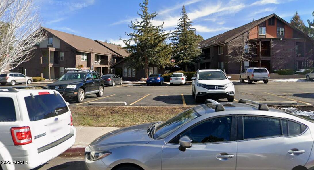 1200 South Riordan Ranch Street, Unit 119 Flagstaff, AZ 86001 - Photo 1 of 1 a view of multiple houses with outdoor space