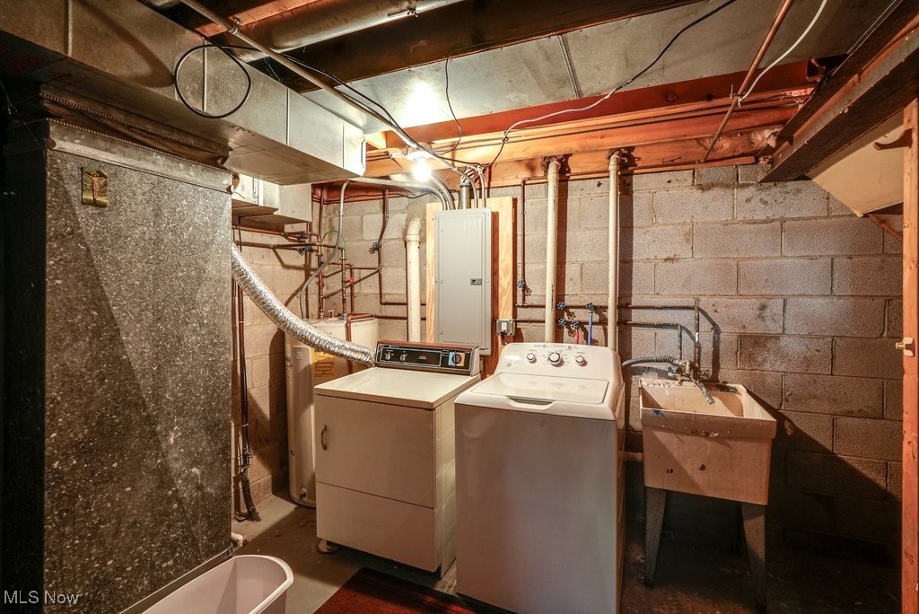 17414 Sheldon Road Brook Park, OH 44142 - Photo 25 of 25 Clothes washing area with washing machine and clothes dryer, electric water heater, electric panel, and sink
