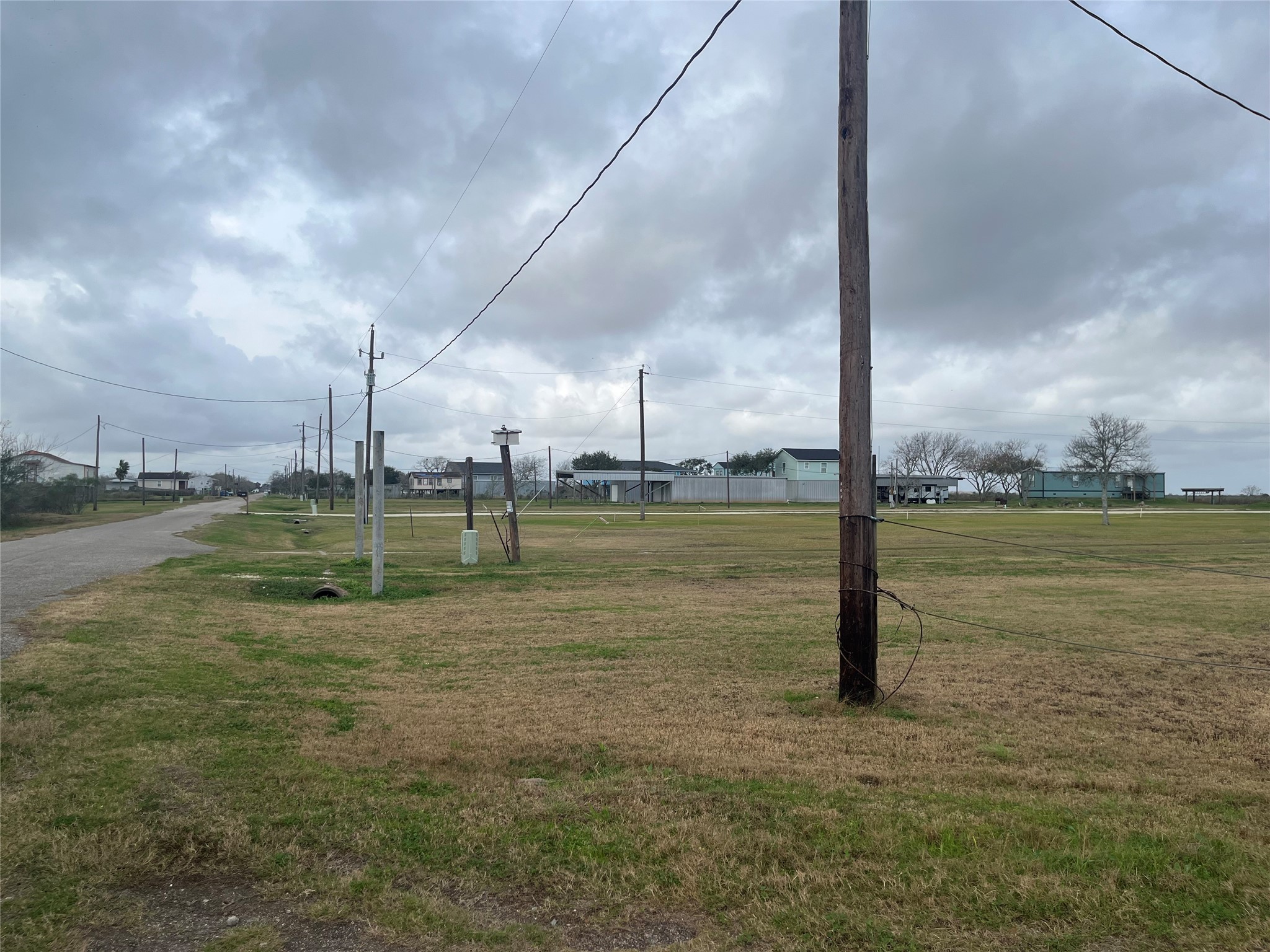 3007 Cr-807a Angleton, TX 77515 - Photo 23 of 28 View from driveway entrance, looking back down the road.