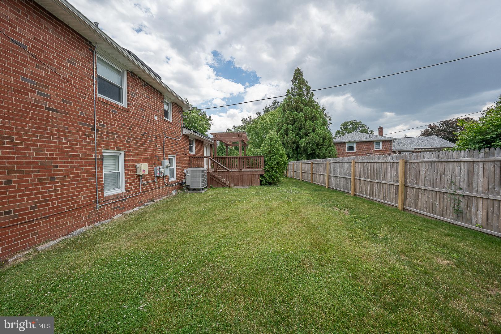 20 Fairview Road Swarthmore, PA 19081 - Photo 55 of 57 a view of a backyard with plants and wooden fence