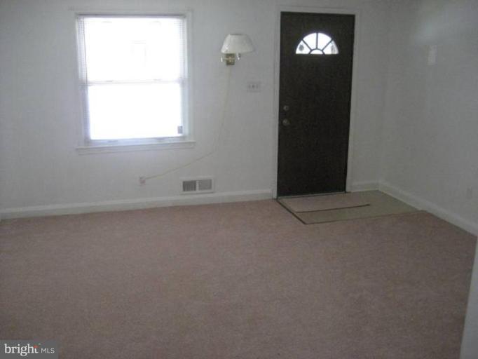 207 Riverthorn Road Middle River, MD 21220 - Photo 2 of 8 an empty room with a window