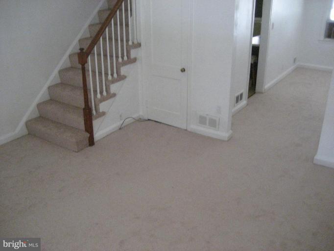 207 Riverthorn Road Middle River, MD 21220 - Photo 3 of 8 a view of a hallway with staircase