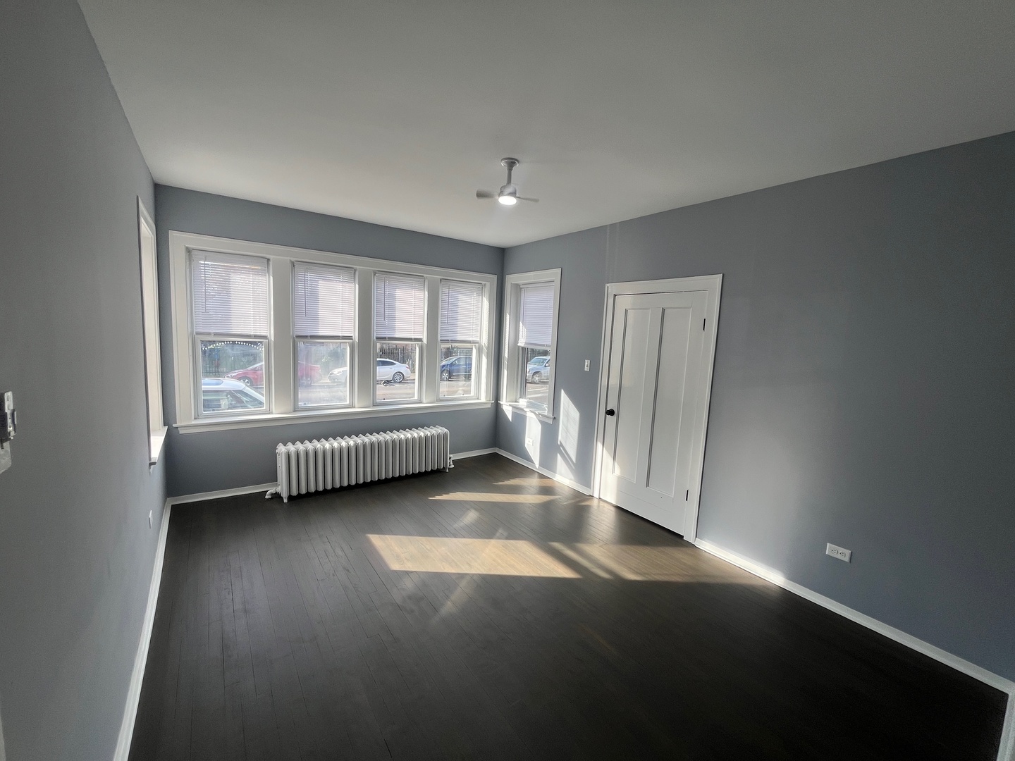 5115 South California Avenue, Unit 1 Chicago, IL 60632 - Photo 2 of 13 a view of a room with wooden floor and window