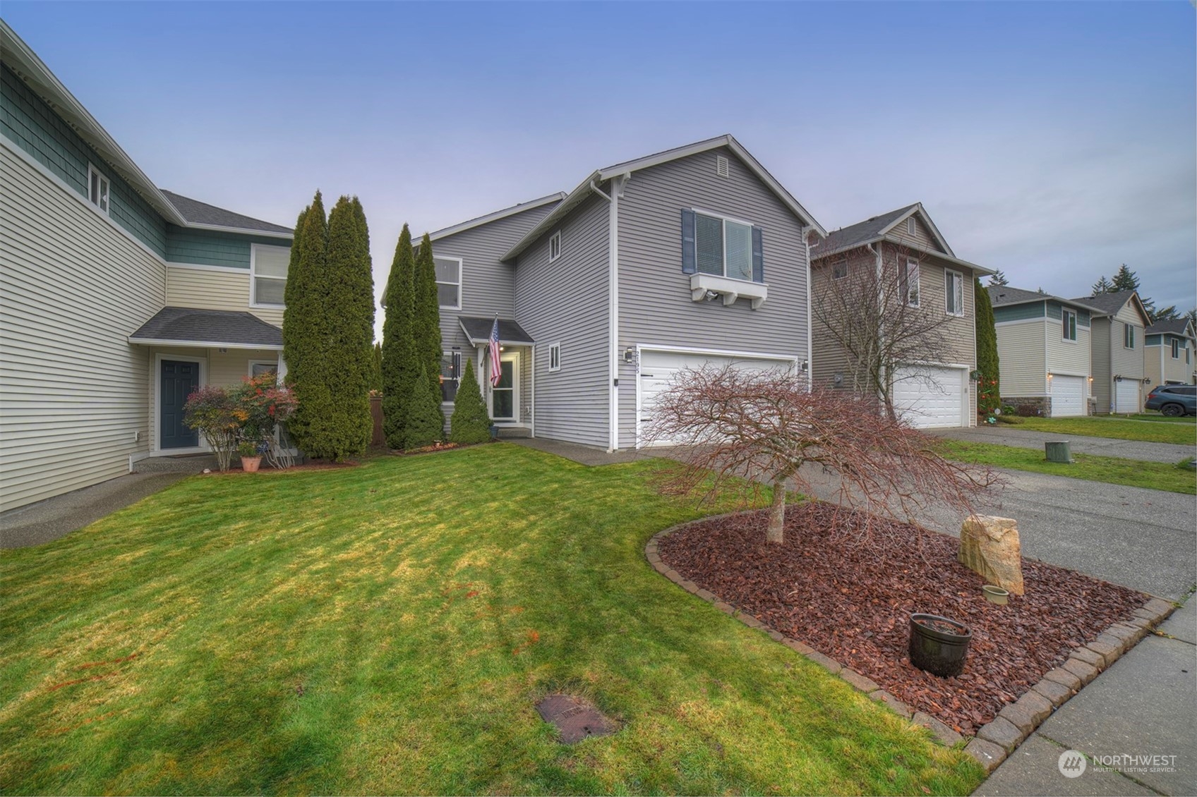 2195 Southwest Grebe Way Port Orchard, WA 98367 - Photo 1 of 40 a front view of a house with garden