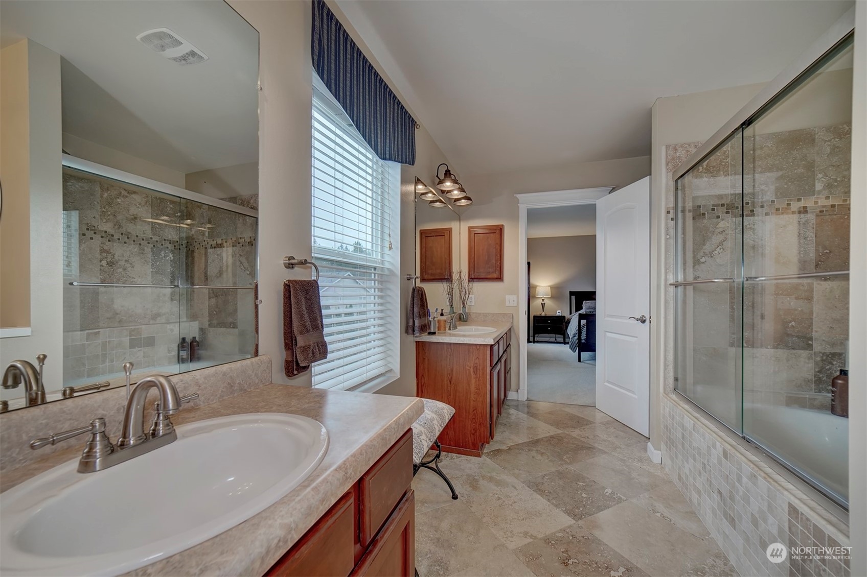 2195 Southwest Grebe Way Port Orchard, WA 98367 - Photo 35 of 40 a bathroom with a tub sink and mirror