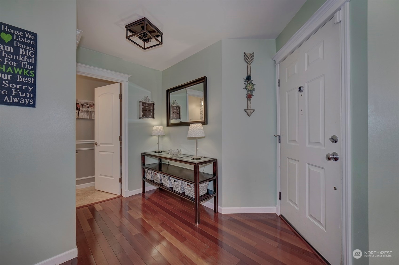 2195 Southwest Grebe Way Port Orchard, WA 98367 - Photo 4 of 40 a view of a hallway with wooden floor and front door