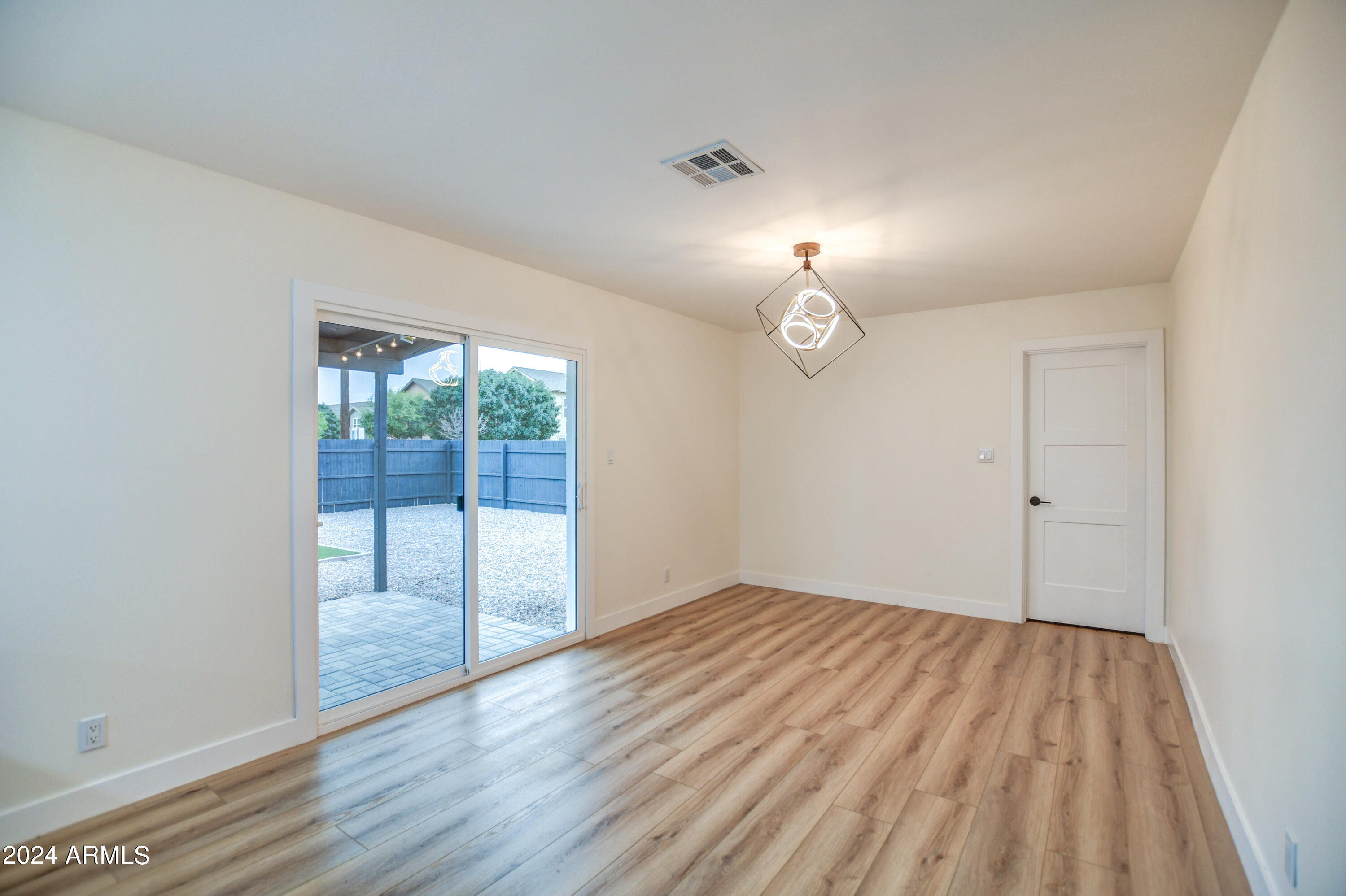 1553 West 5th Place Tempe, AZ 85281 - Photo 13 of 30 wooden floor in an empty room with a window