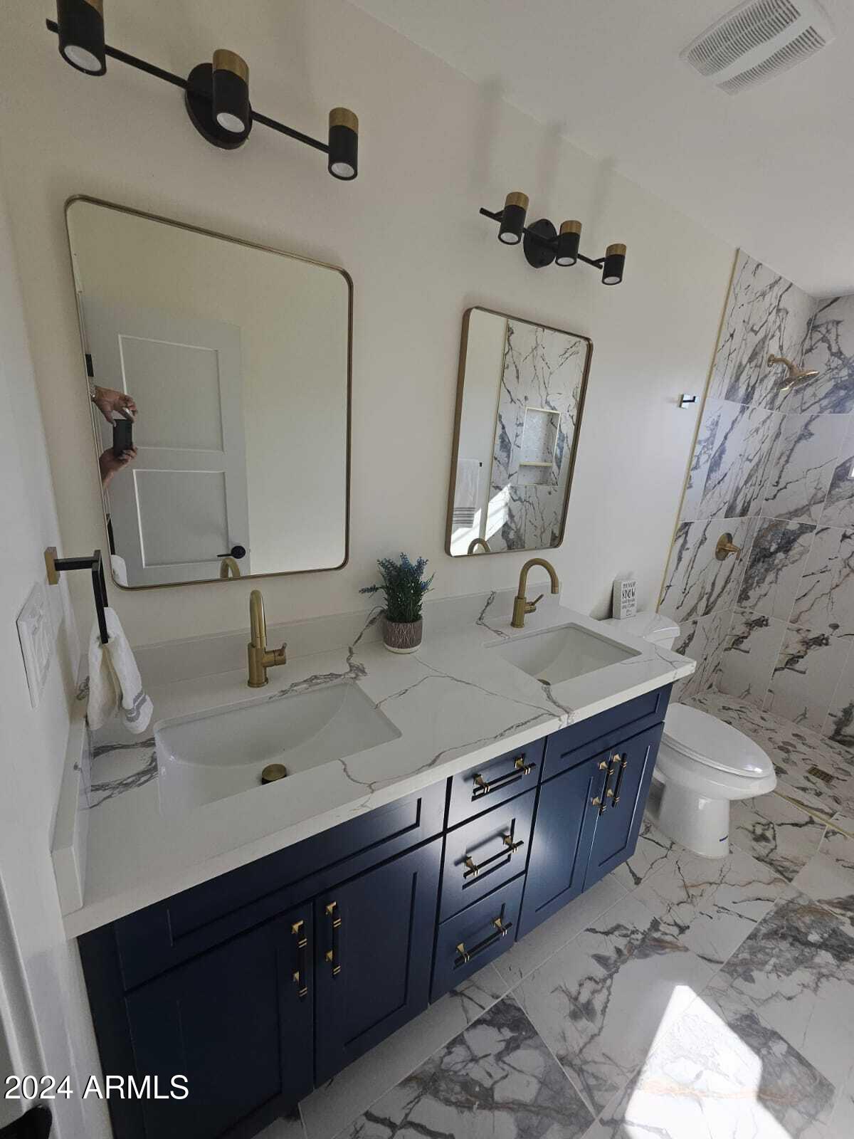1553 West 5th Place Tempe, AZ 85281 - Photo 21 of 30 a bathroom with a granite countertop sink and a mirror