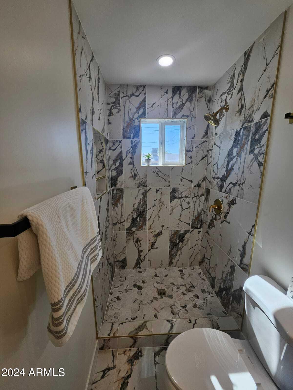 1553 West 5th Place Tempe, AZ 85281 - Photo 22 of 30 a bathroom with a toilet and a shower