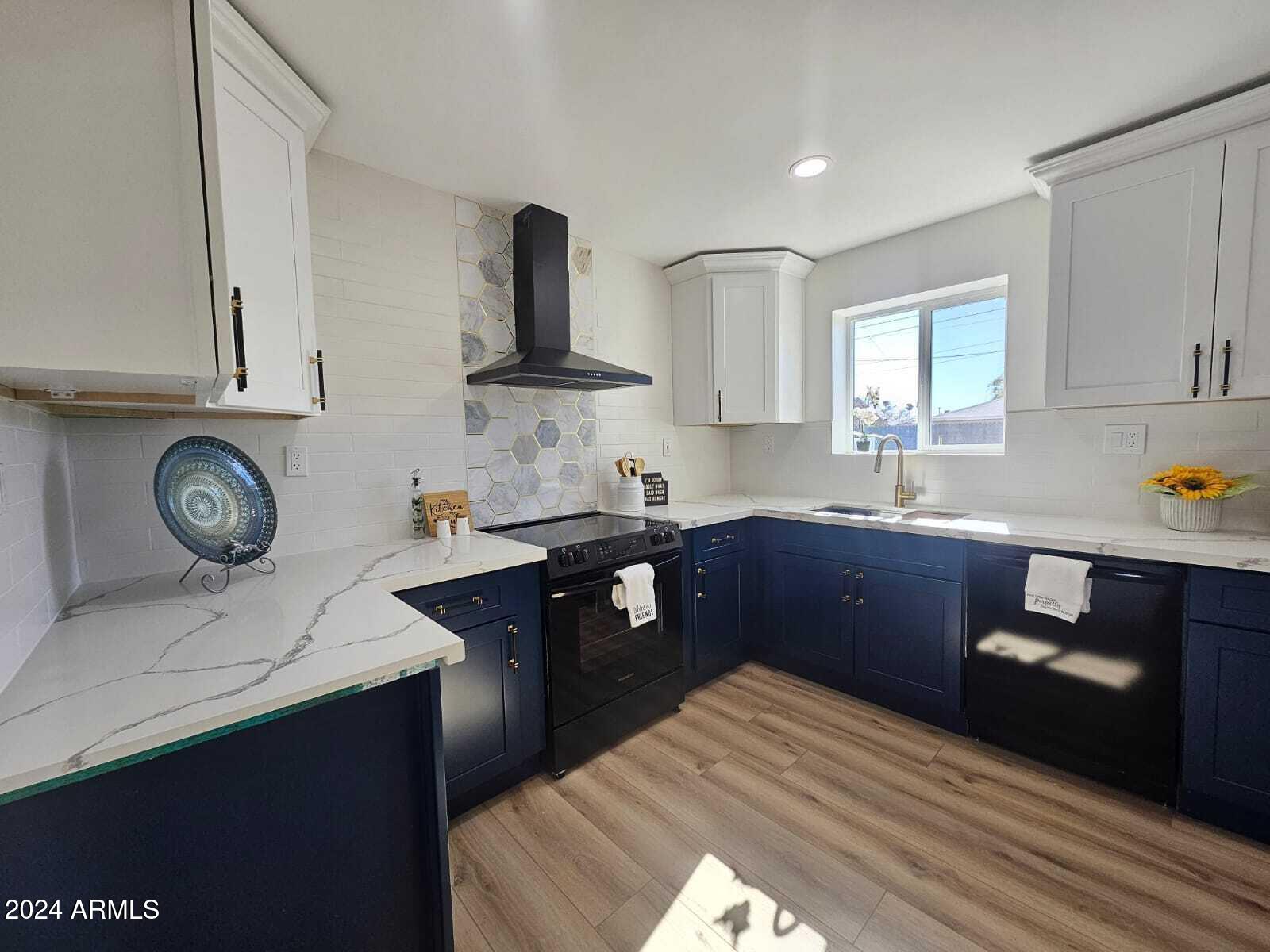 1553 West 5th Place Tempe, AZ 85281 - Photo 4 of 30 a kitchen with a sink a stove and cabinets