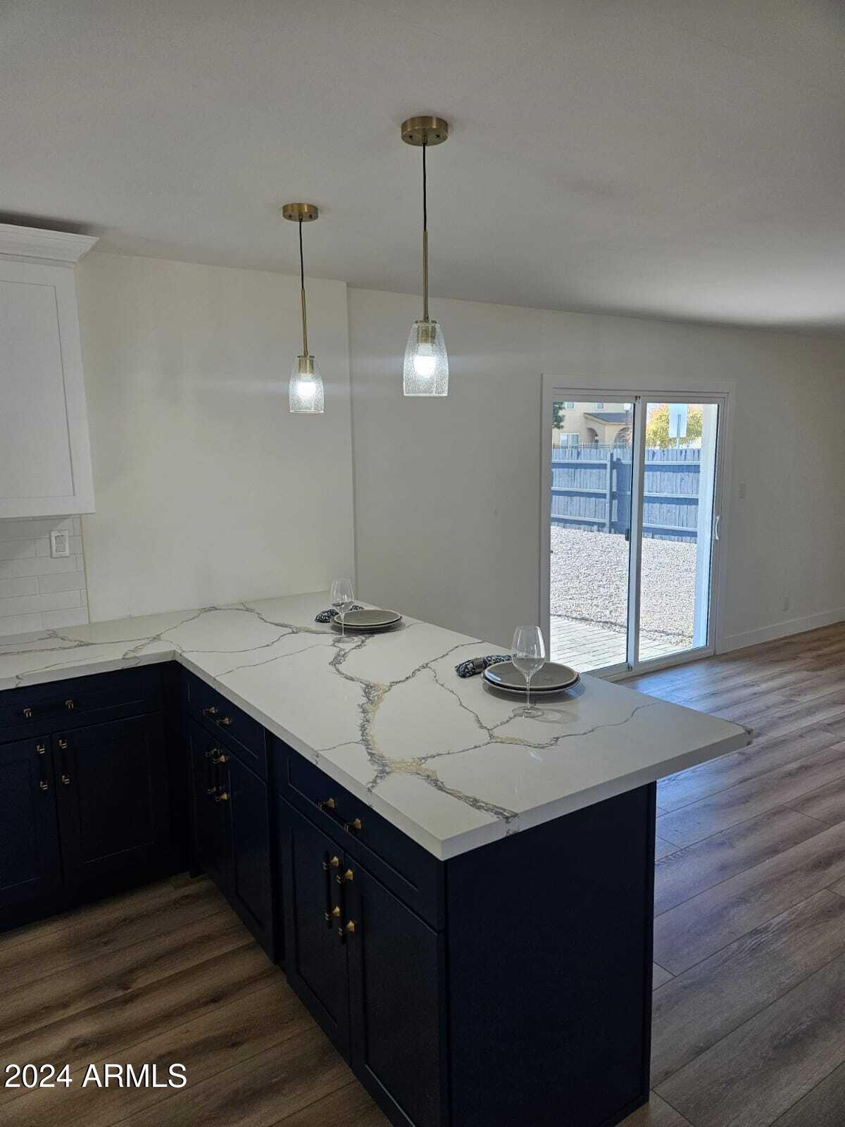 1553 West 5th Place Tempe, AZ 85281 - Photo 10 of 30 a kitchen with a sink cabinets and window