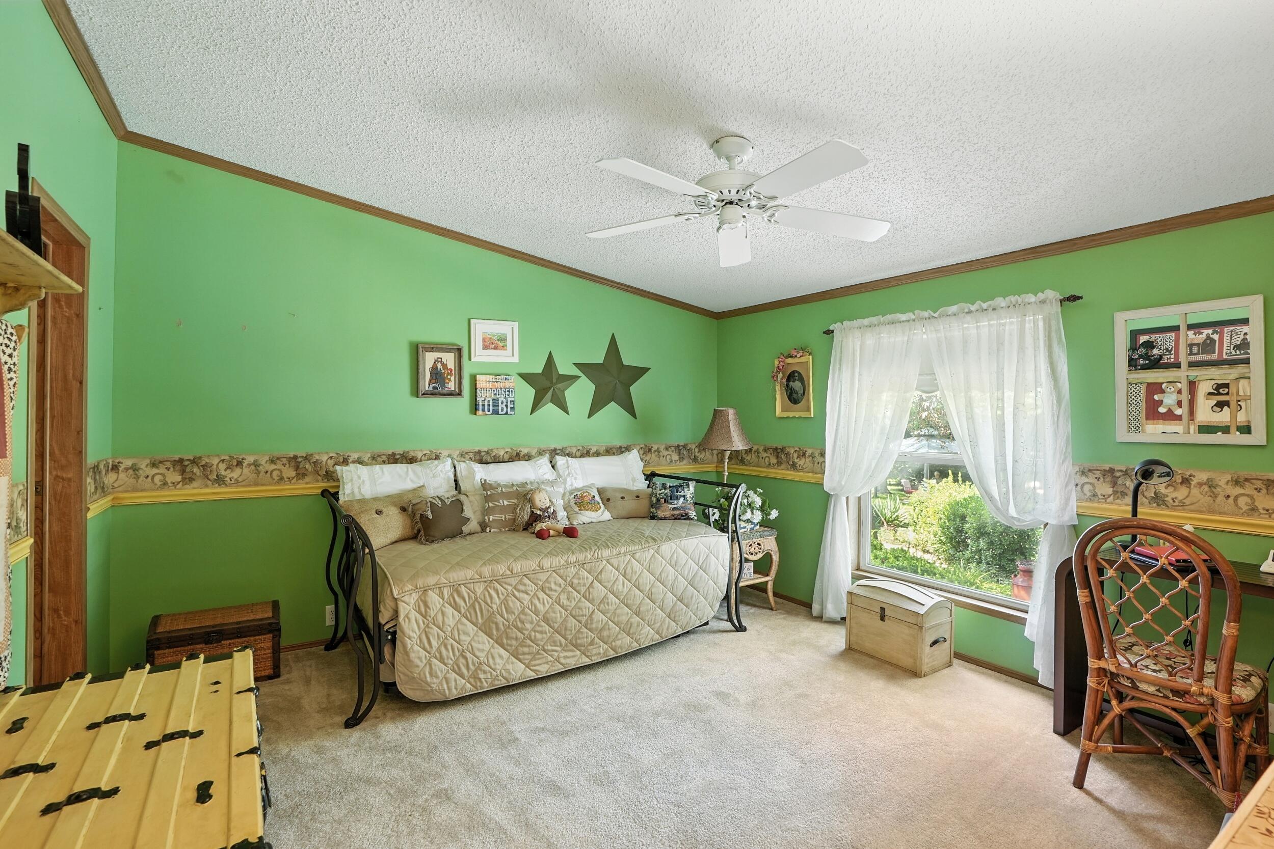 15338 Harrison Street Crown Point, IN 46307 - Photo 11 of 32 a bedroom with a bed and a window