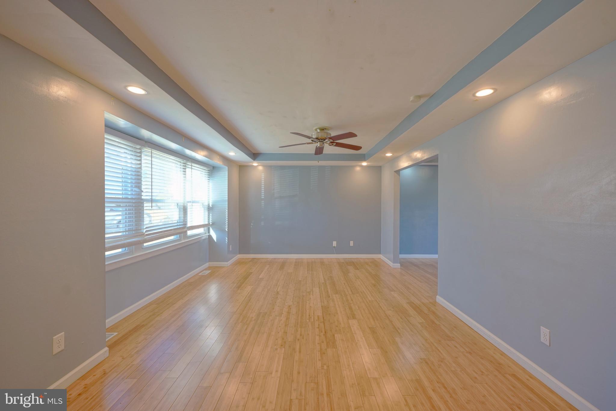 523 Carver Court Lawnside, NJ 08045 - Photo 12 of 39 a view of empty room with wooden floor and fan