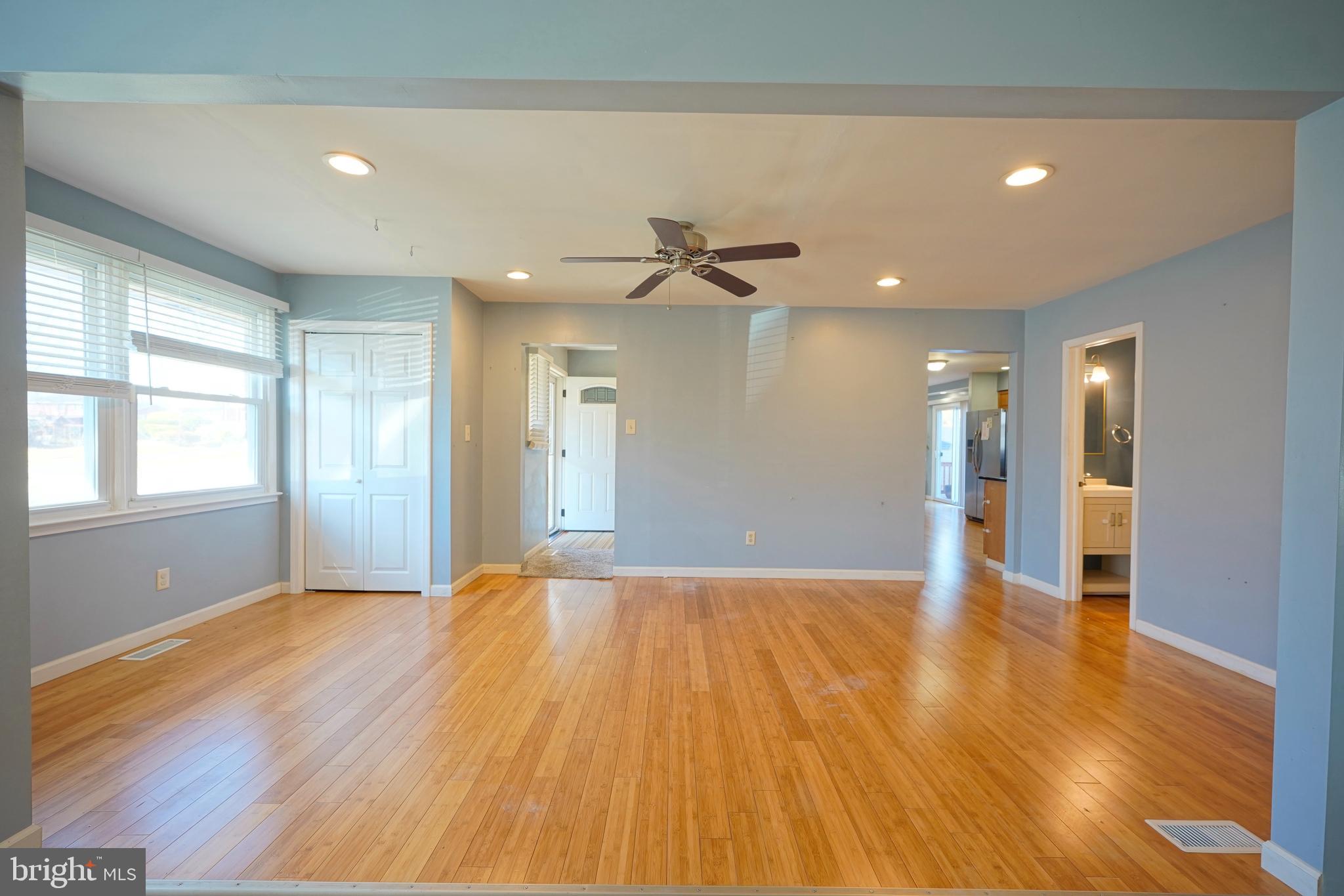 523 Carver Court Lawnside, NJ 08045 - Photo 13 of 39 a view of an empty room with wooden floor and a window