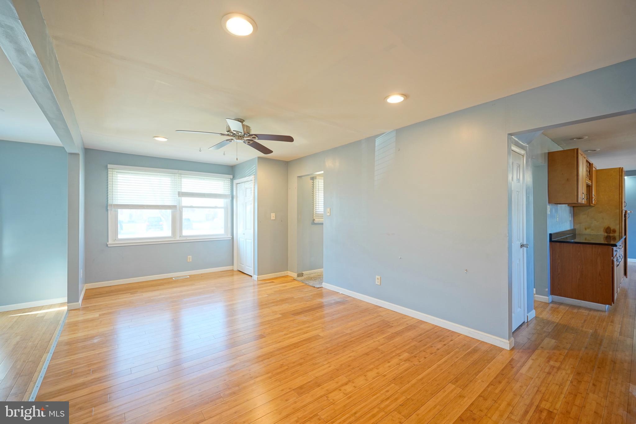 523 Carver Court Lawnside, NJ 08045 - Photo 14 of 39 a view of empty room with wooden floor and fan
