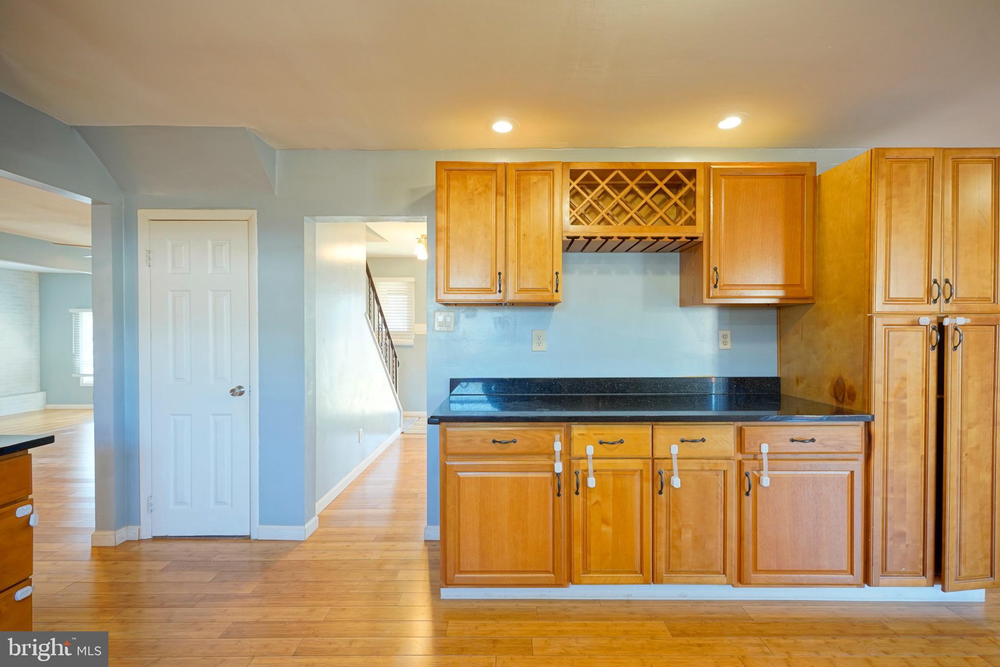 523 Carver Court Lawnside, NJ 08045 - Photo 15 of 39 a view of a kitchen with wooden floor and staircase