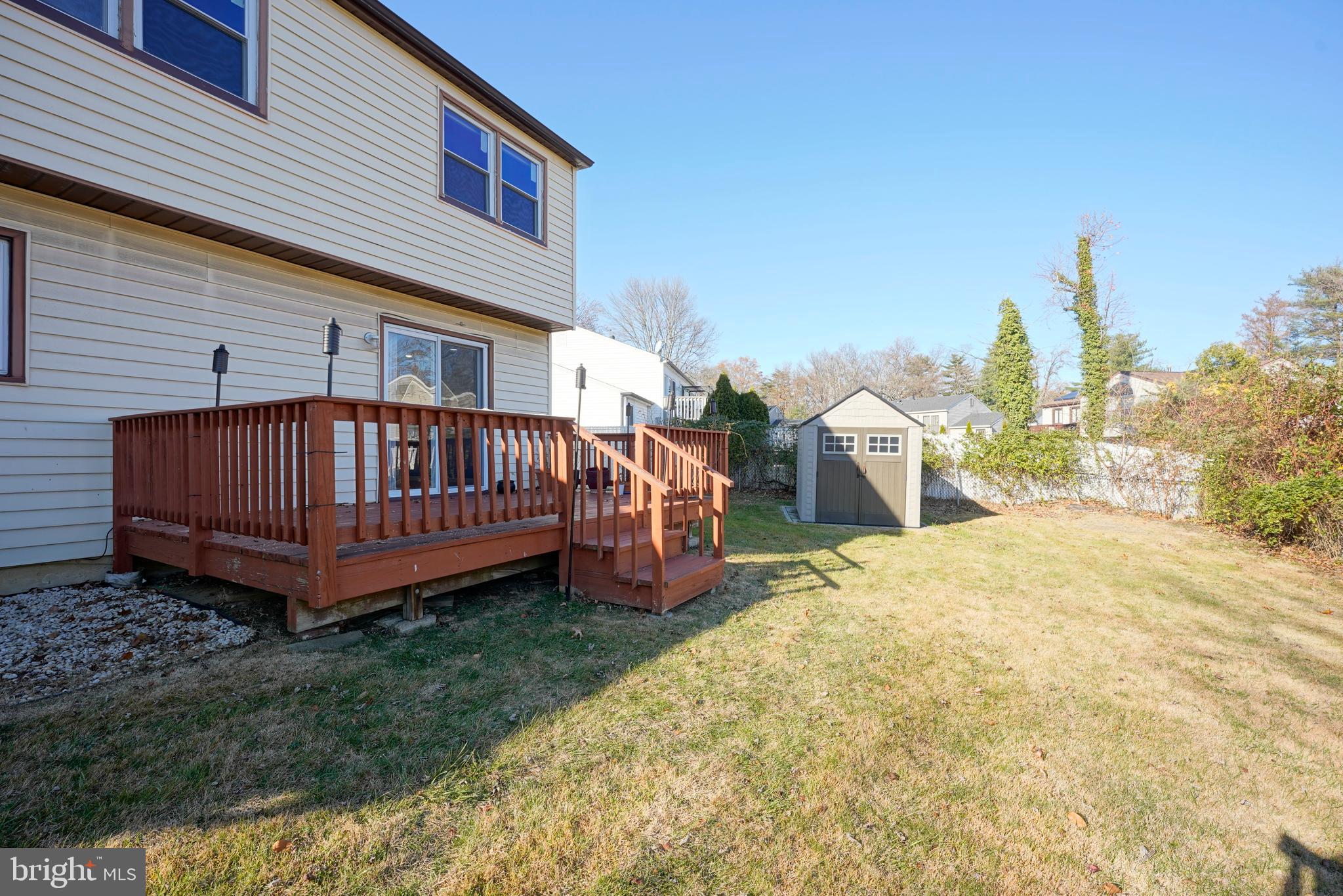 523 Carver Court Lawnside, NJ 08045 - Photo 8 of 39 a view of a backyard with a small yard and wooden fence