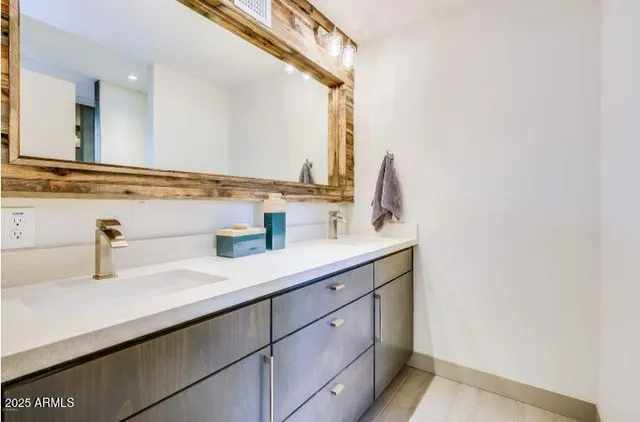 a bathroom with a sink and a mirror