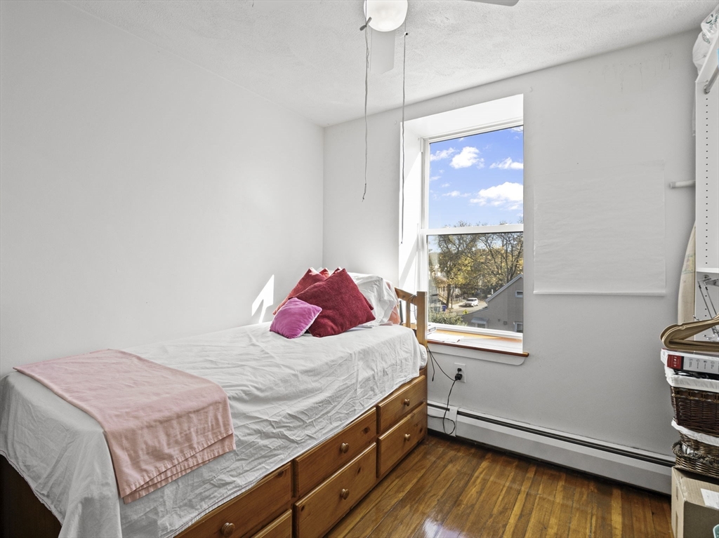 95 Florida Street, Unit 2 Boston, MA 02124 - Photo 16 of 29 a bedroom with a bed and a window