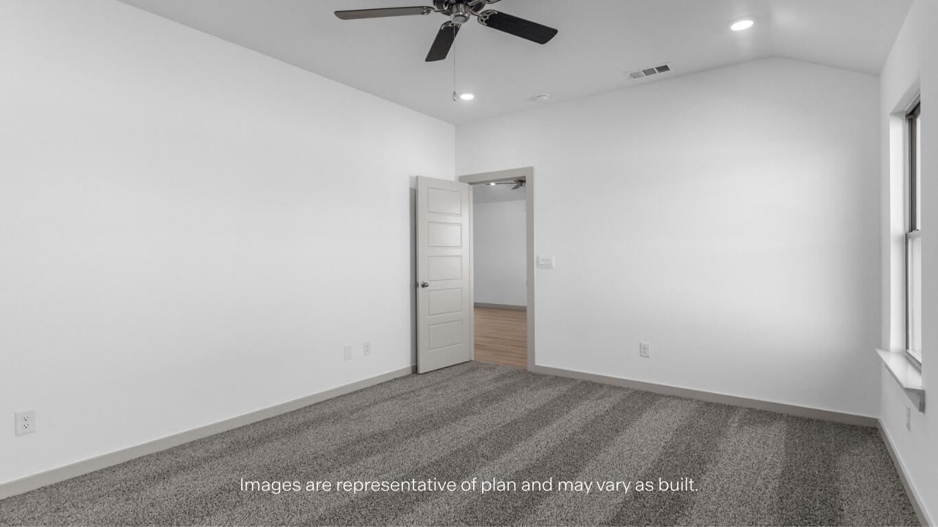 2305 150th Place Lubbock, TX 79423 - Photo 10 of 14 an empty room with a ceiling fan and carpet
