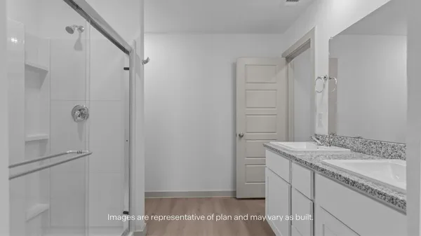 an empty room with a ceiling fan and carpet