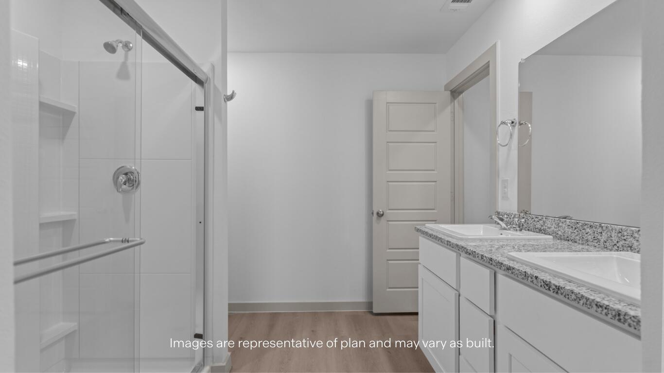2305 150th Place Lubbock, TX 79423 - Photo 11 of 14 a bathroom with a granite countertop sink and a mirror