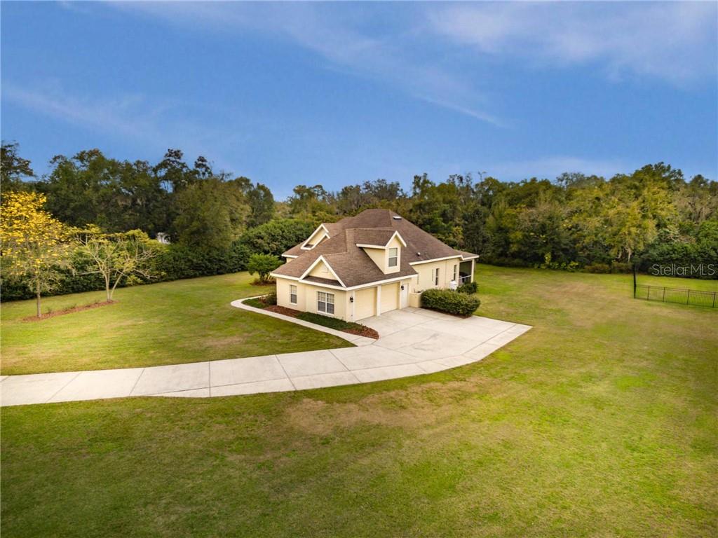 2106 Durant Road Valrico, FL 33596 - Photo 1 of 1 Welcome Home to your custom built retreat on 1.01 acres of beautiful Florida landscaping!