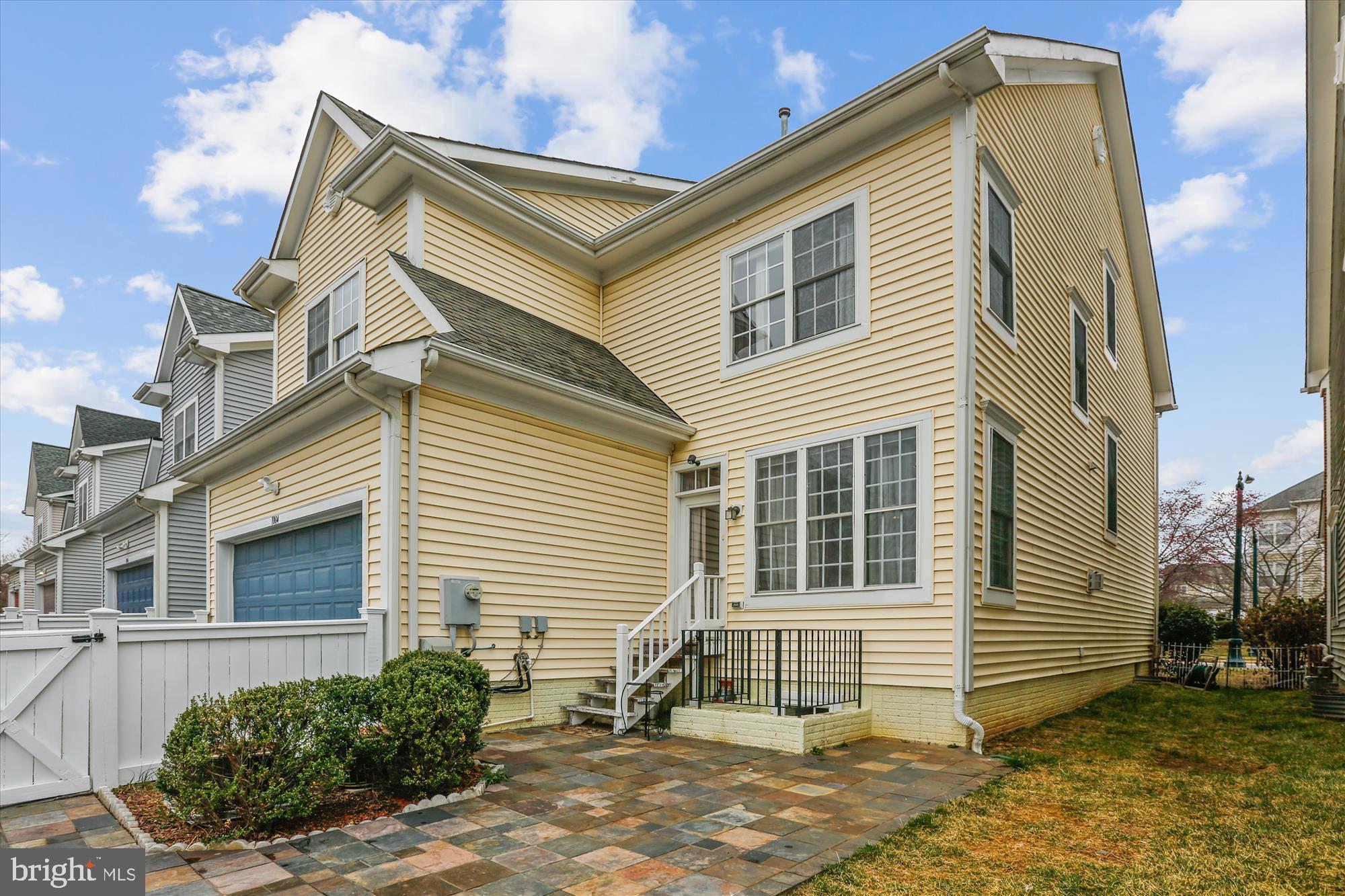 1004 Gaither Road Rockville, MD 20850 - Photo 2 of 34 a view of a house with a backyard