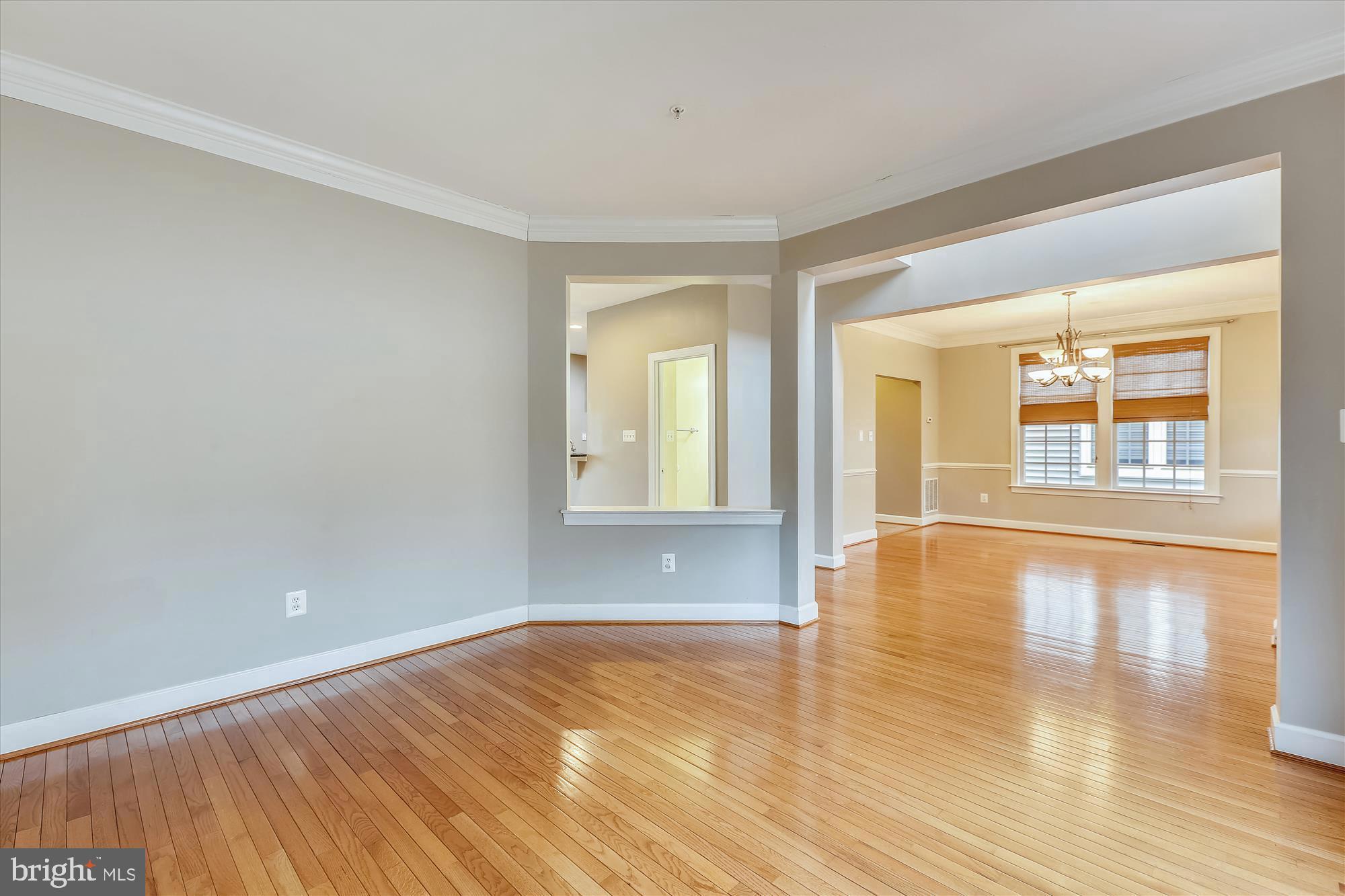 1004 Gaither Road Rockville, MD 20850 - Photo 9 of 34 wooden floor in an empty room with a window