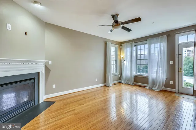 a view of livingroom with hardwood floor and a ceiling fan