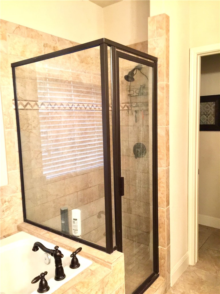 10052 Janet Loop Dripping Springs, TX 78620 - Photo 18 of 26 Master Bathroom with Separate Shower and Tile
