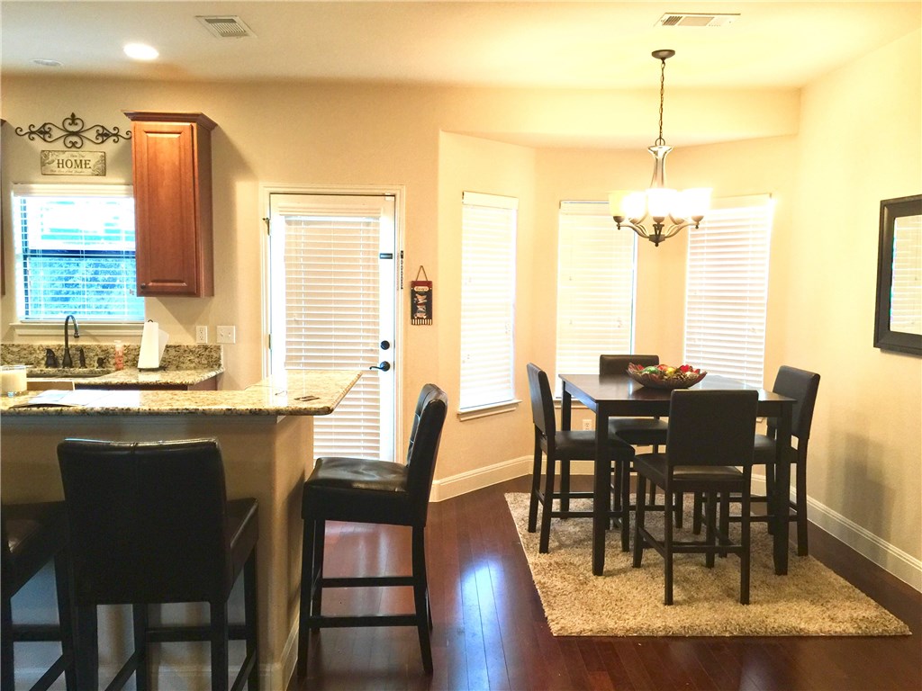 10052 Janet Loop Dripping Springs, TX 78620 - Photo 6 of 26 Bar Seating and Dining Area