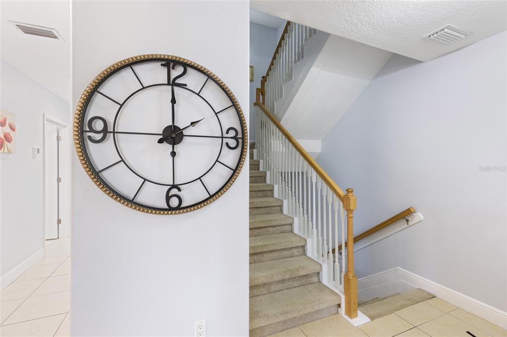 141 175th Avenue East Redington Shores, FL 33708 - Photo 14 of 51 a view of staircase with a large window