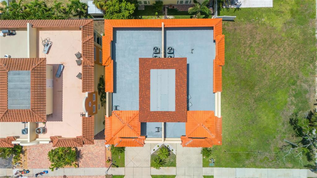 141 175th Avenue East Redington Shores, FL 33708 - Photo 38 of 51 an aerial view of a house with a yard and seating space