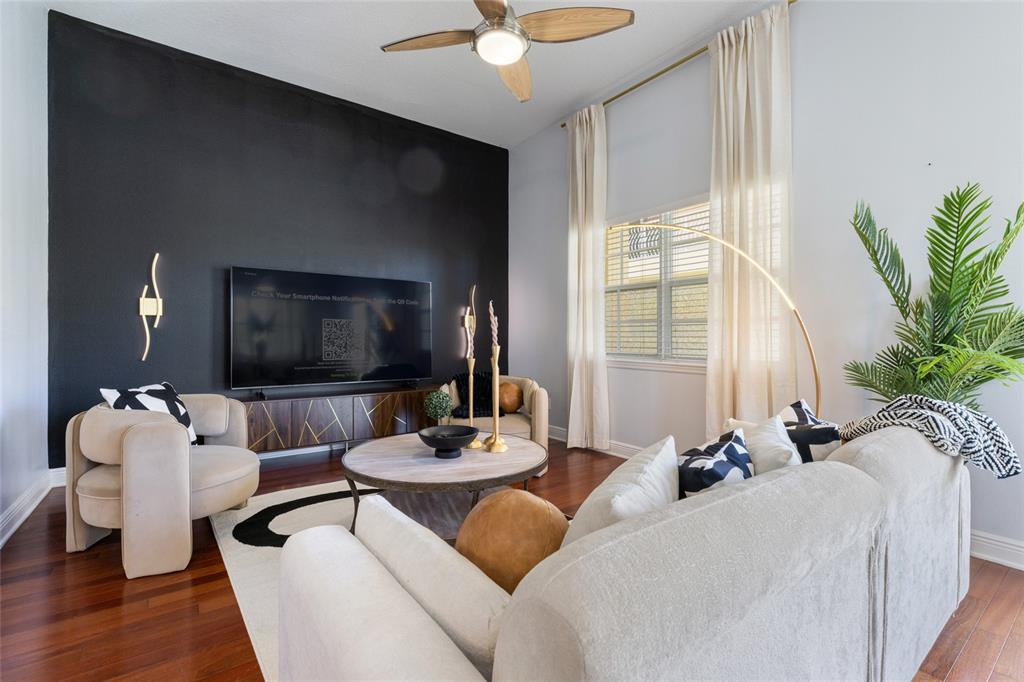141 175th Avenue East Redington Shores, FL 33708 - Photo 9 of 51 a living room with furniture and a flat screen tv