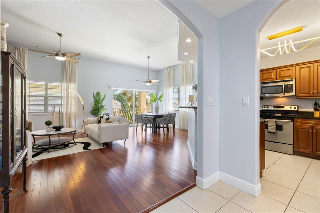 141 175th Avenue East Redington Shores, FL 33708 - Photo 10 of 51 a view of kitchen and dining room with wooden floor