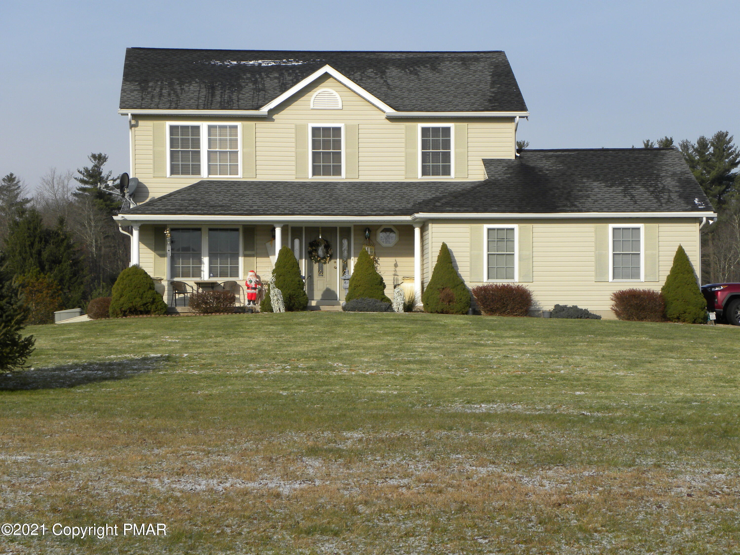 a front view of a house with garden