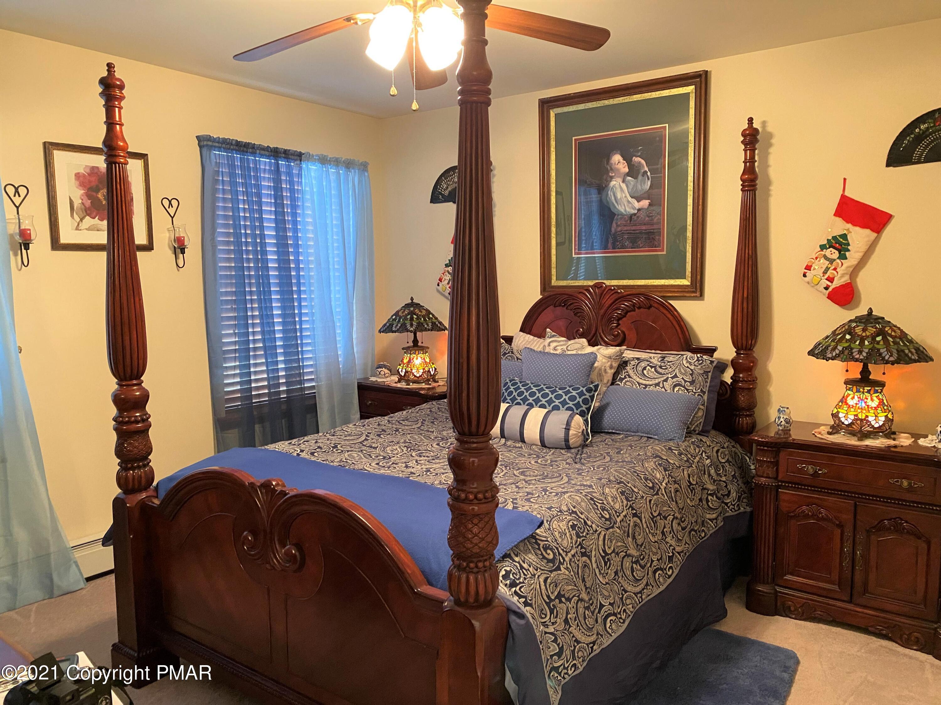 341 Chestnut Road Blakeslee, PA 18610 - Photo 18 of 30 a bedroom with a bed and wooden floor