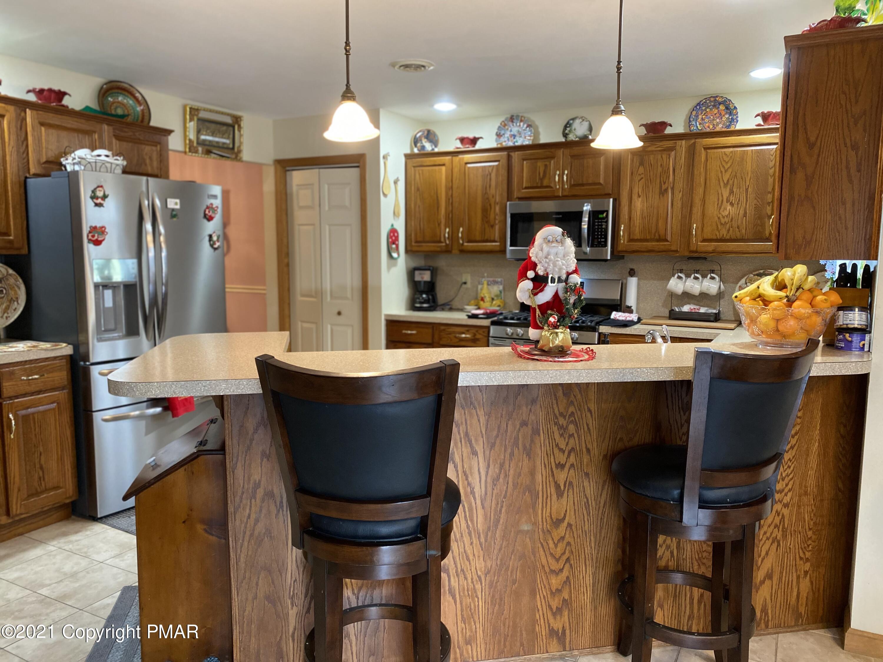 341 Chestnut Road Blakeslee, PA 18610 - Photo 6 of 30 a view of a dining room with furniture and a chandelier