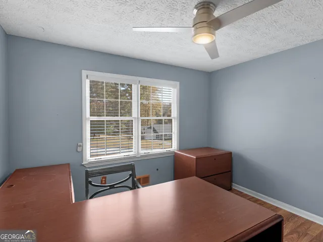 a room with a bed and a window