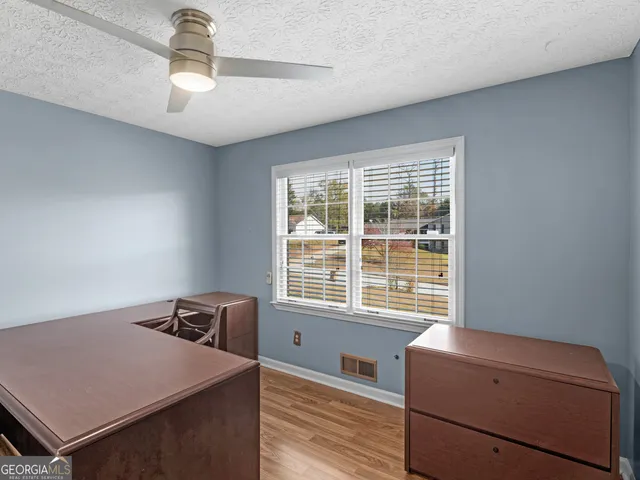 a room with furniture and wooden floor