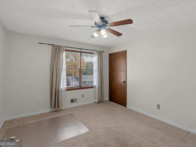 a blue room with furniture and window