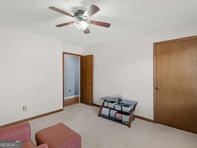 an empty room with windows and closet