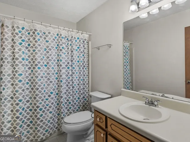 a bathroom with a sink double vanity and a mirror