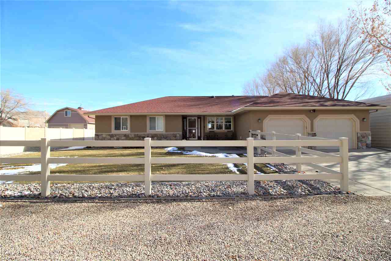 3455 F Road Clifton, CO 81520 - Photo 1 of 29 a front view of a house with a yard