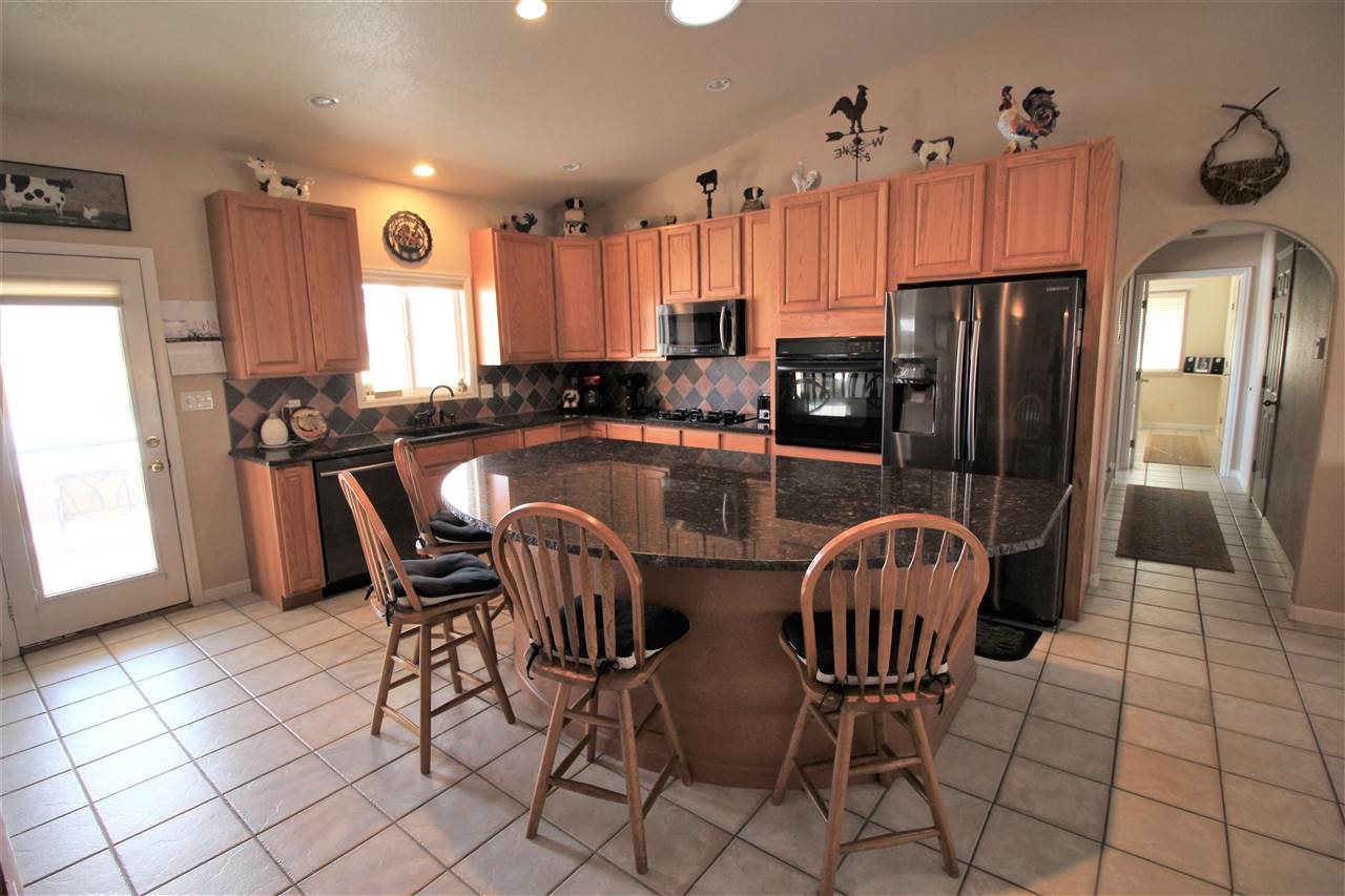 3455 F Road Clifton, CO 81520 - Photo 12 of 29 a view of kitchen with dining area and windows