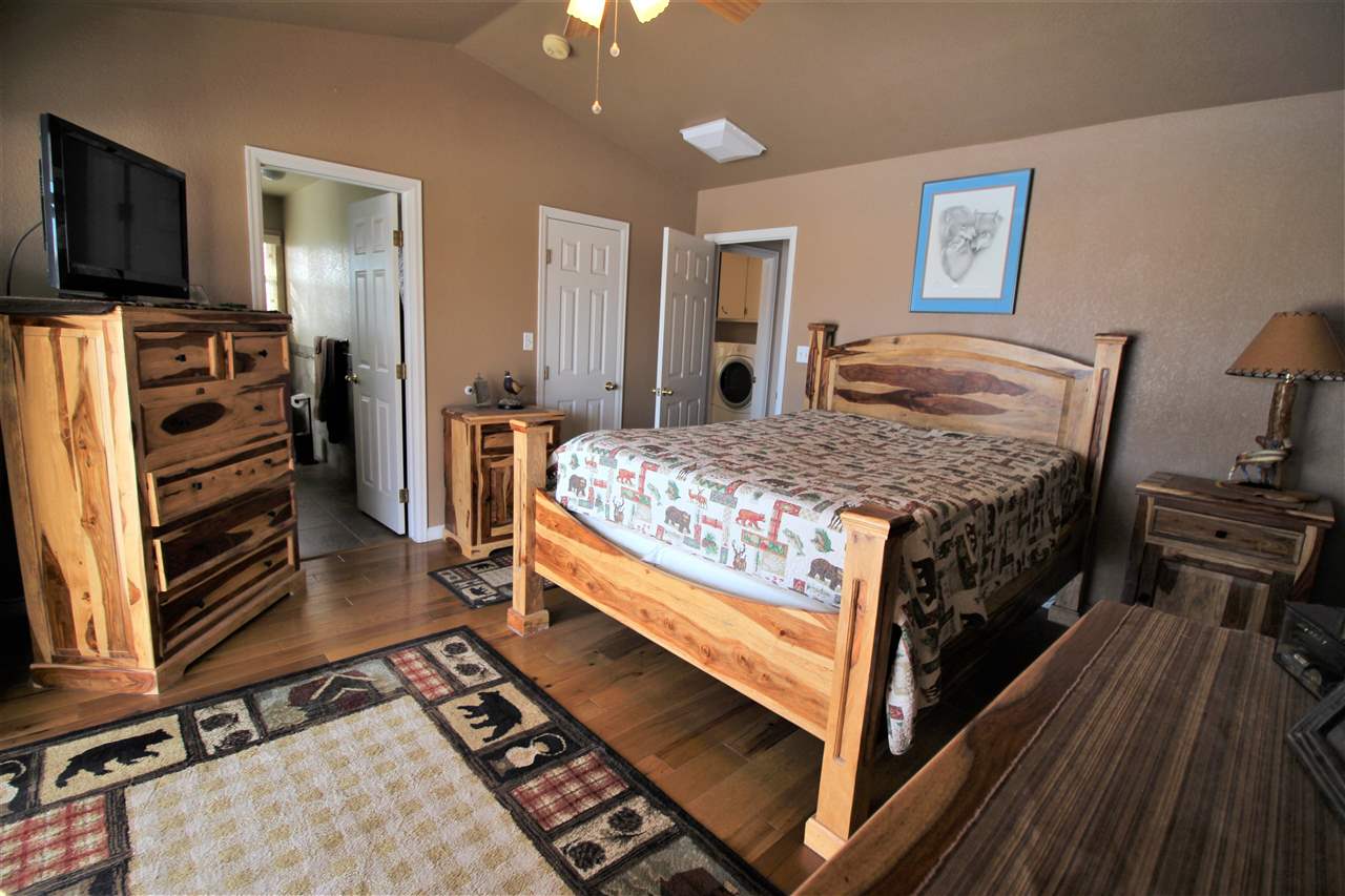 3455 F Road Clifton, CO 81520 - Photo 15 of 29 a bedroom with a bed and a flat screen tv