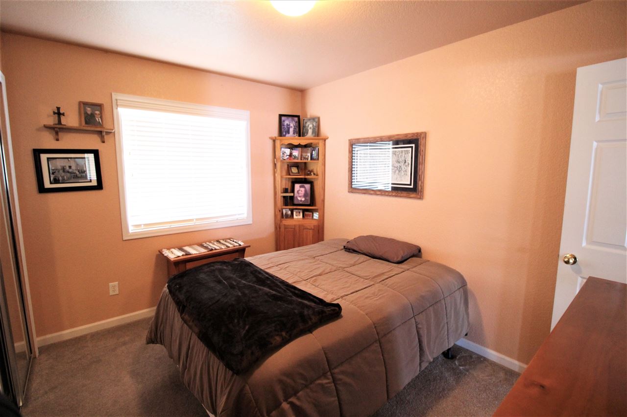 3455 F Road Clifton, CO 81520 - Photo 17 of 29 a bedroom with a bed and a window